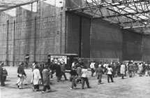 Men and women reporting to work at Consolidated Aircraft 