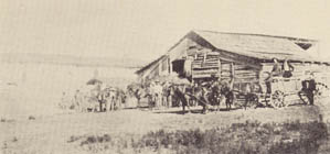 Early Days at Agua Tibia Ranch -- The stable and corral, with the long, whitewashed adobe ranch-house in the distance.