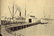 A much-rebuilt Civil War tug, the white-hulled Pinta (right) was dwarfed even by the little passenger-steamer Corona, as they lay at the old Pacific Coast Steamship Co. wharf