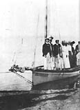 Claude Ledger is seen at extreme left in yachting party.